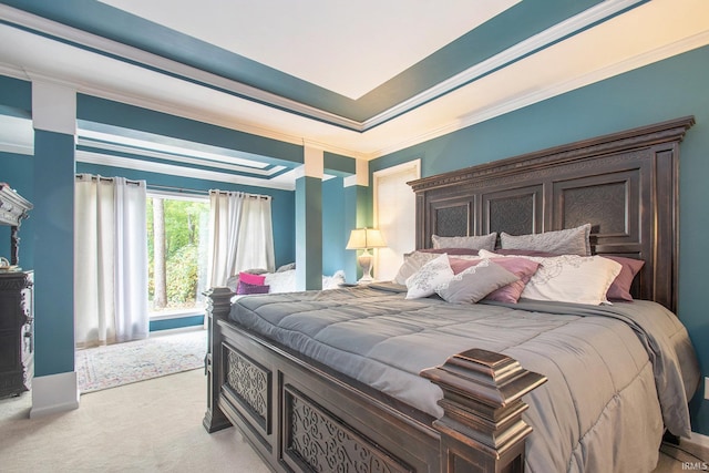 bedroom with ornamental molding, light colored carpet, and a raised ceiling