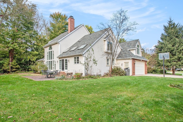 exterior space with a garage and a lawn