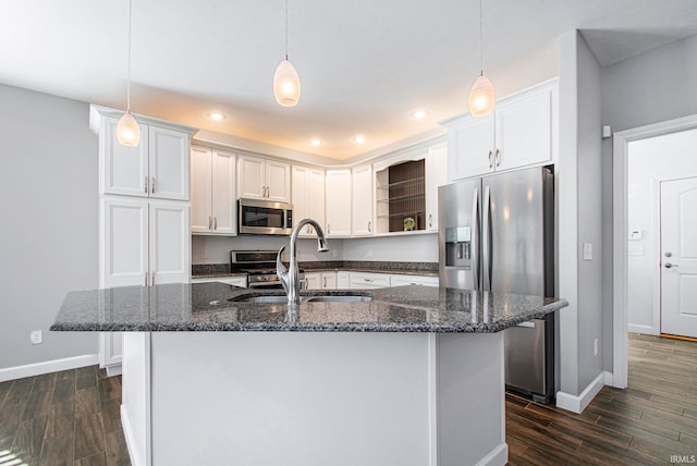 kitchen with dark wood-type flooring, white cabinets, stainless steel appliances, and sink