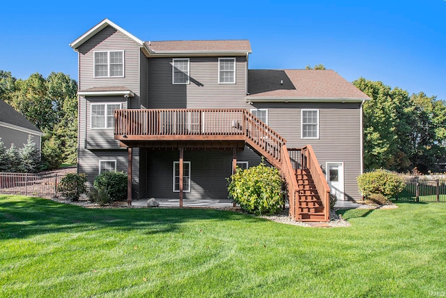 back of property featuring a deck and a lawn