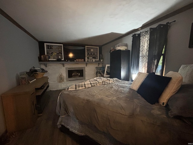 bedroom featuring crown molding and hardwood / wood-style flooring