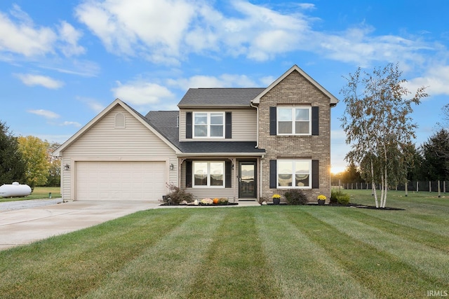 view of front facade with a front yard and a garage