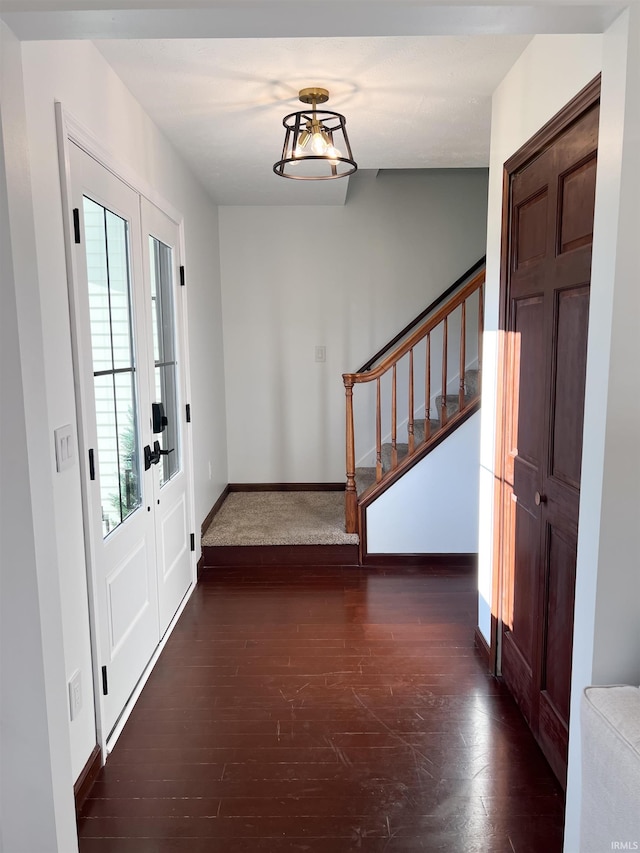 entrance foyer featuring dark wood-type flooring