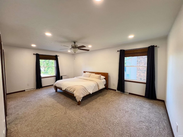 carpeted bedroom featuring ceiling fan