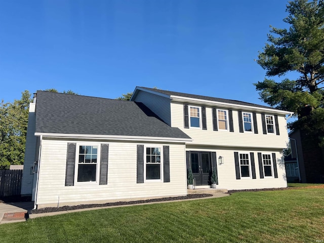 colonial inspired home with a front yard