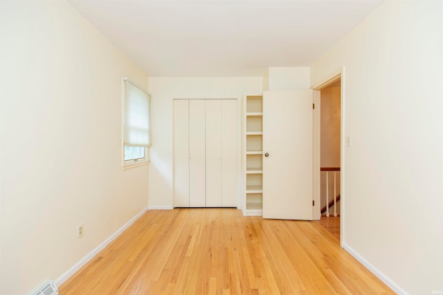 unfurnished bedroom featuring light hardwood / wood-style floors