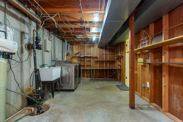 basement with washer / clothes dryer and sink