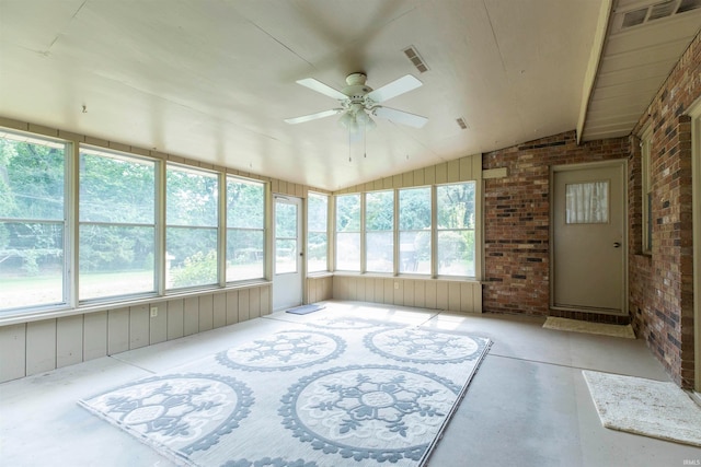 sunroom / solarium with lofted ceiling, a healthy amount of sunlight, and ceiling fan