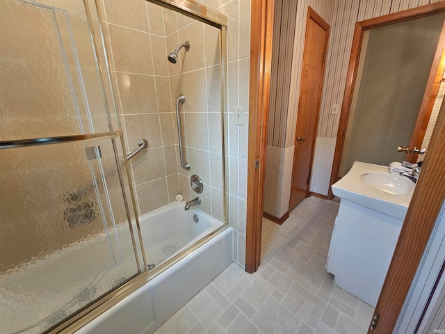 bathroom featuring vanity and combined bath / shower with glass door