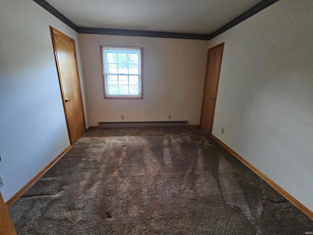 carpeted empty room featuring ornamental molding and a baseboard radiator