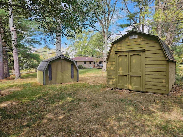 view of outbuilding with a lawn