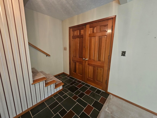 entrance foyer with a textured ceiling