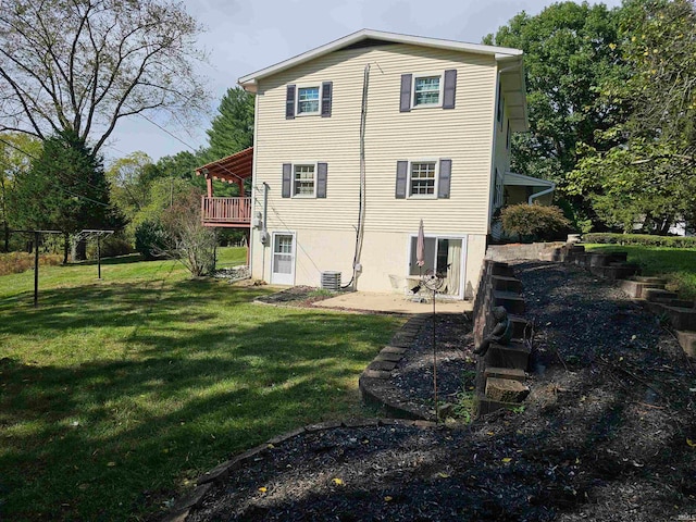 back of property with cooling unit, a yard, and a deck