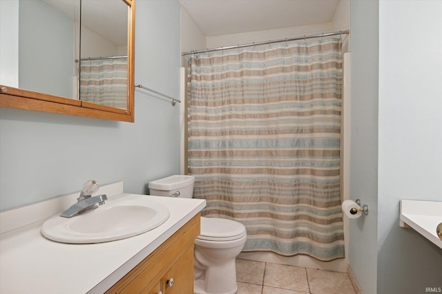 bathroom with vanity, a shower with curtain, toilet, and tile patterned flooring