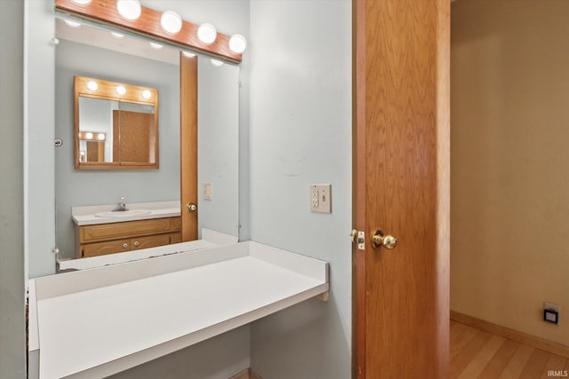 bathroom featuring vanity and wood-type flooring