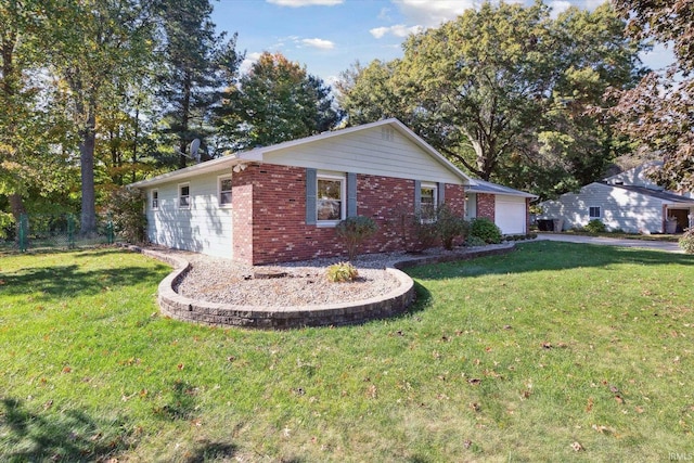 view of property exterior featuring a lawn and a garage