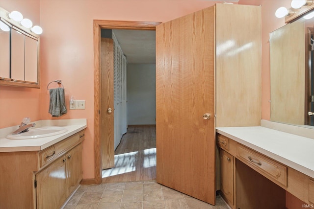 bathroom featuring vanity and hardwood / wood-style flooring