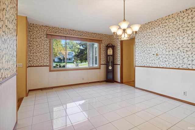 unfurnished dining area with a notable chandelier and light tile patterned floors