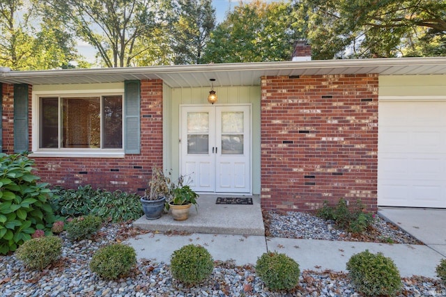 doorway to property featuring a garage