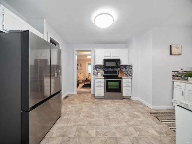 kitchen with appliances with stainless steel finishes, white cabinetry, and tasteful backsplash