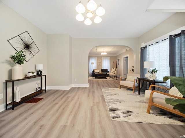 interior space with a chandelier and light wood-type flooring