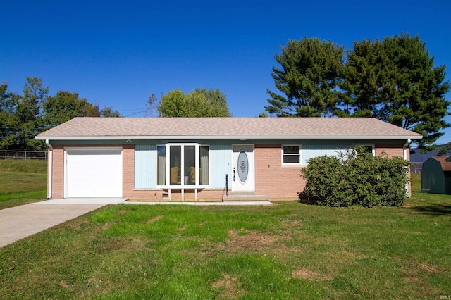 single story home featuring a front yard and a garage