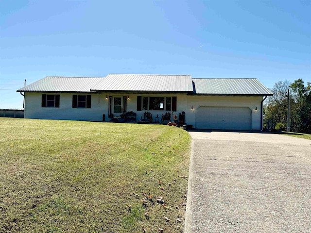 single story home with a front lawn and a garage