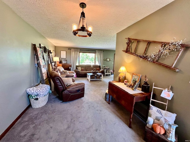 living room featuring a notable chandelier, a textured ceiling, and carpet floors