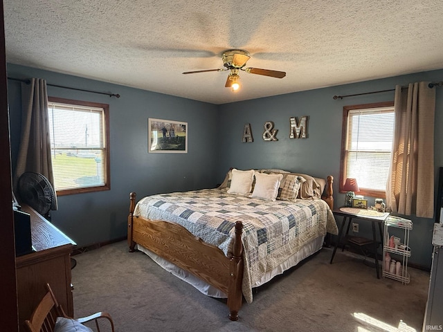 bedroom with dark carpet, multiple windows, and ceiling fan