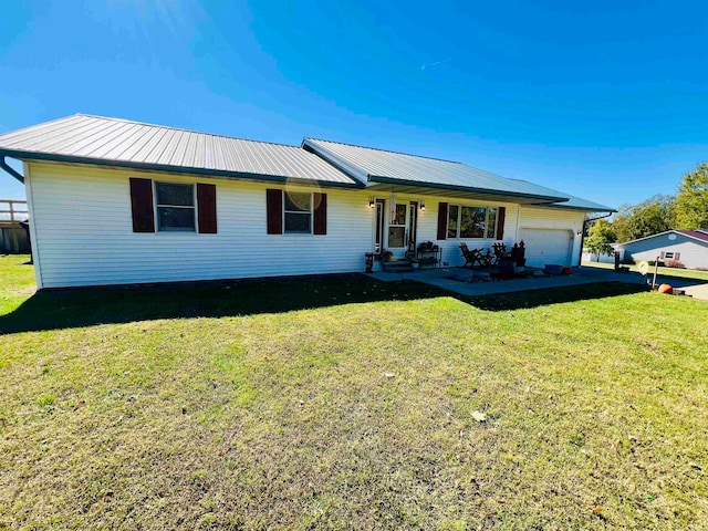 single story home featuring a front yard and a garage