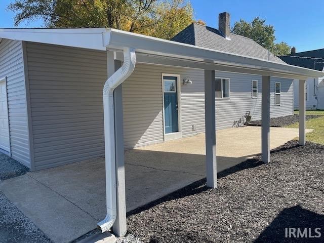 view of property exterior featuring a patio area