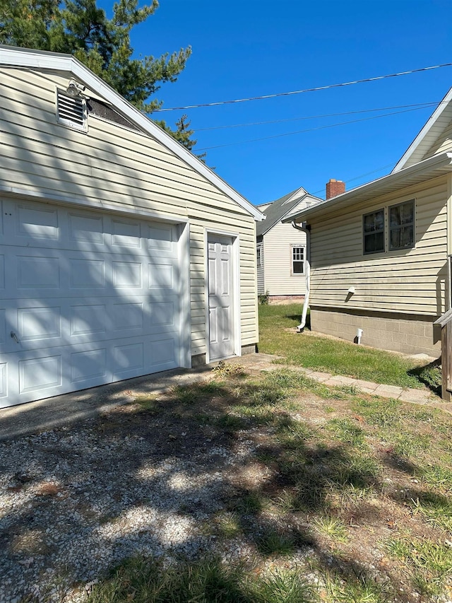 exterior space with an outdoor structure and a garage