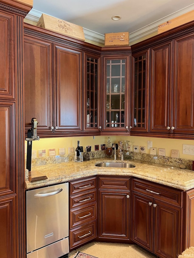 kitchen with ornamental molding, dishwasher, light stone countertops, and sink