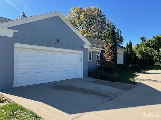 view of side of property with a garage