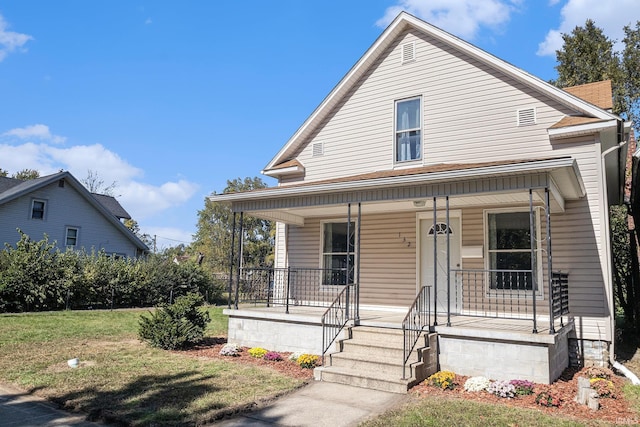 view of front of house featuring a porch and a front lawn