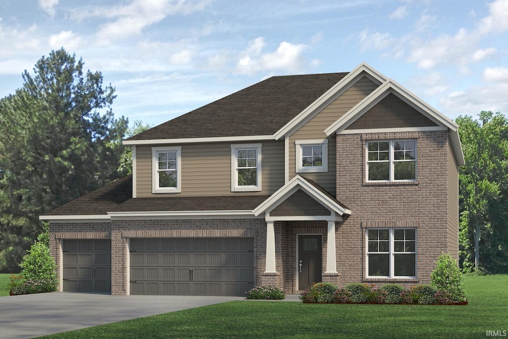 view of front of home with a front lawn and a garage