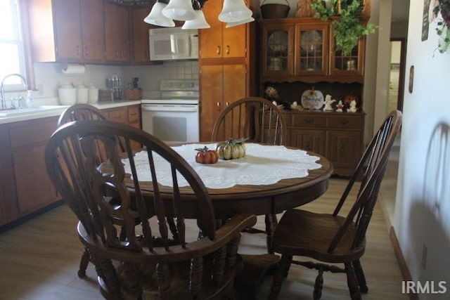 dining area with light wood-type flooring