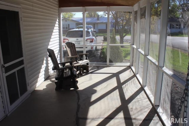 sunroom / solarium featuring a healthy amount of sunlight