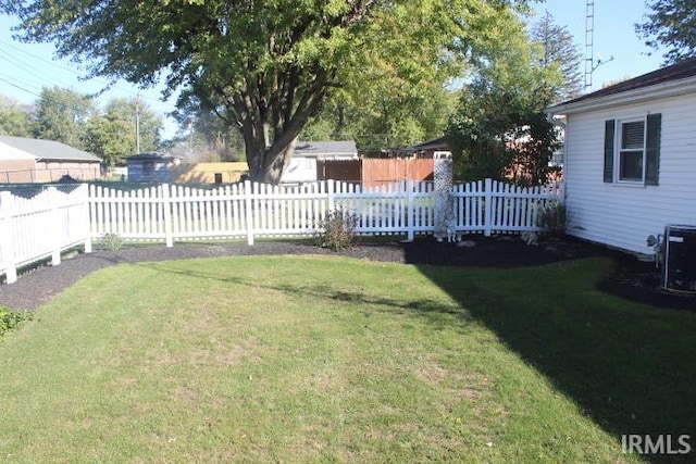 view of yard featuring central AC