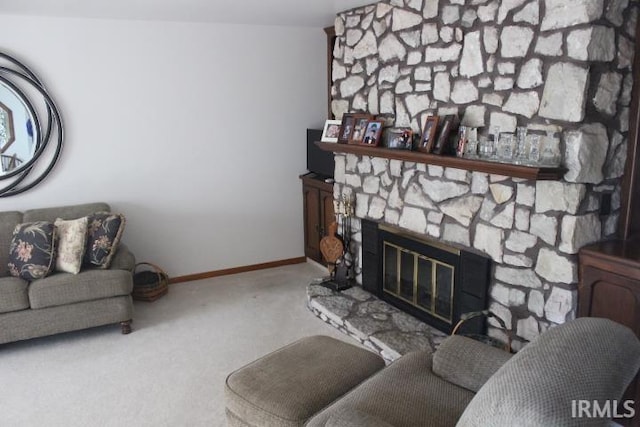 living room with light carpet and a fireplace