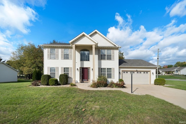 view of front of home with a front lawn and a garage