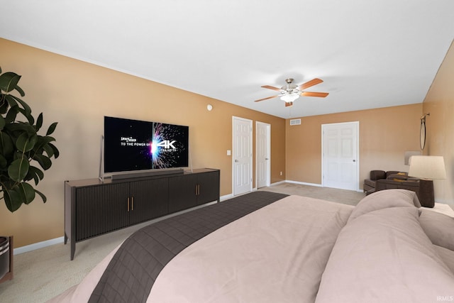 bedroom with light carpet and ceiling fan