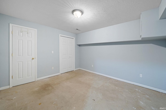 spare room featuring a textured ceiling