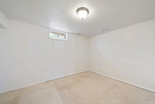 basement with a textured ceiling