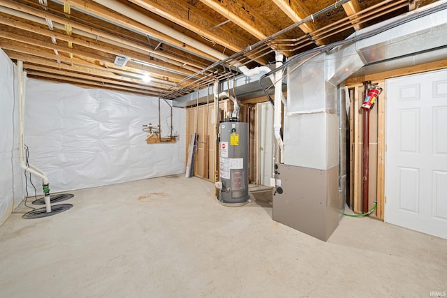 basement featuring water heater and heating unit