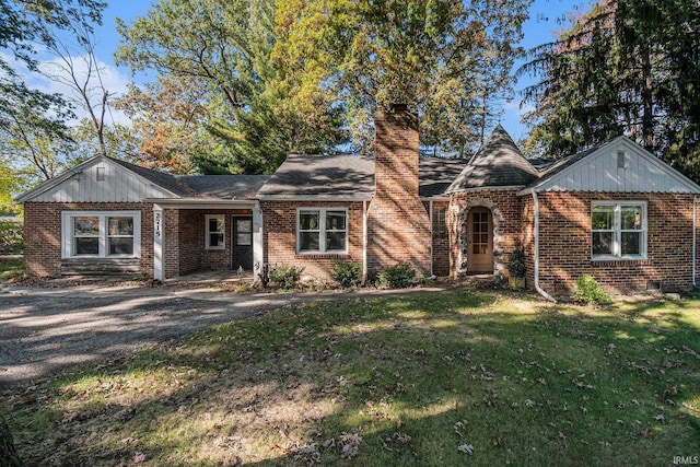 ranch-style home with a front lawn