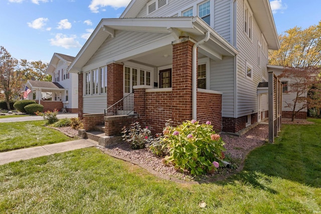 view of home's exterior with a lawn