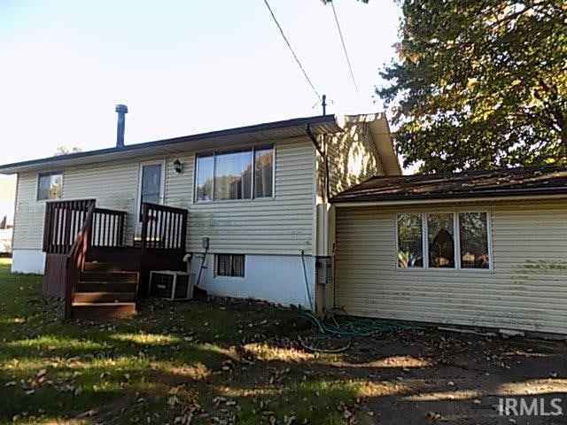 rear view of property featuring central air condition unit