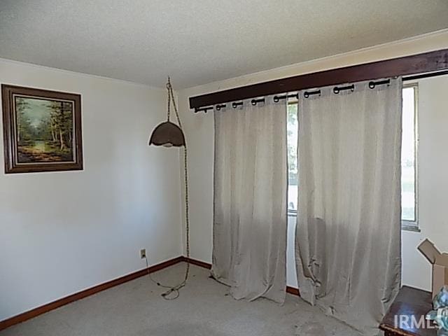 spare room with a textured ceiling