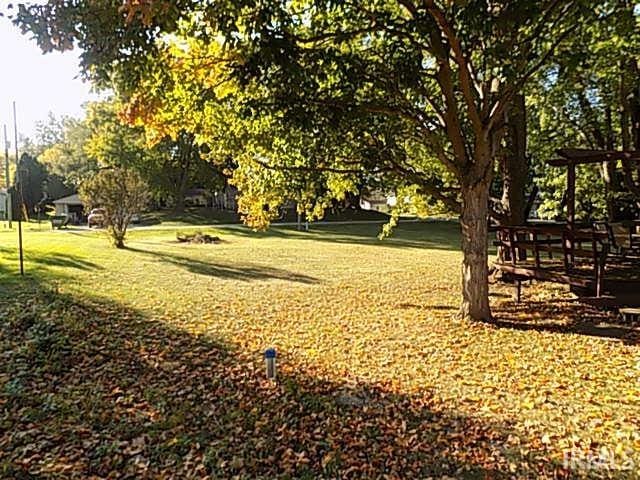 view of home's community with a lawn